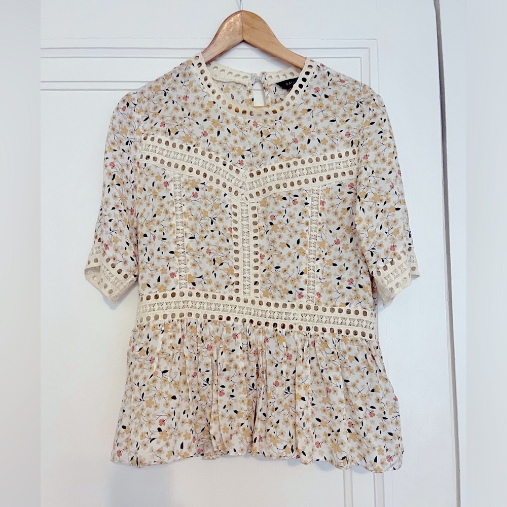 Floral peplum with eyelet detail top from Anthropologie